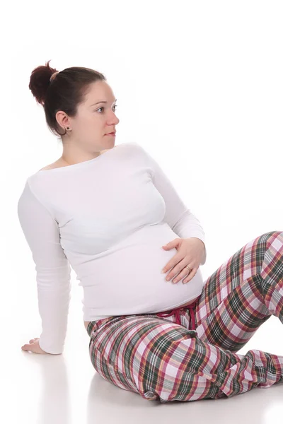 Těhotná žena drží břicho — Stock fotografie