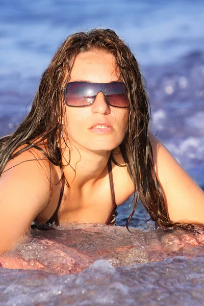 stock image Young woman at beach