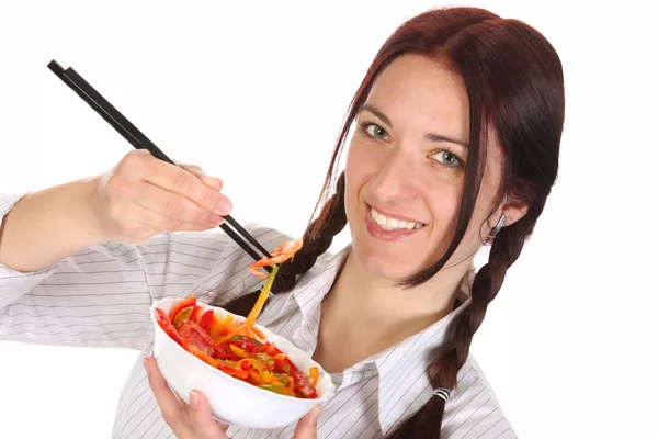 Beautiful woman eating with chopsticks — Stock Photo, Image