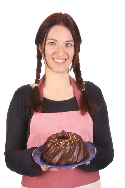 Housewife showing off bundt cake — Stock Photo, Image