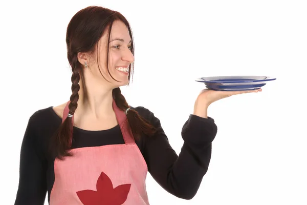 Housewife holding empty plate — Stock Photo, Image