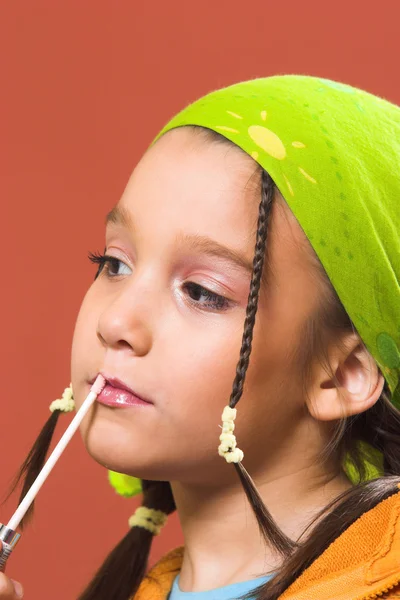 Child applying make-up — Stock Photo, Image