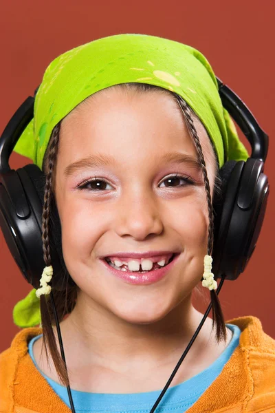 Child listening music in headphones — Stock Photo, Image