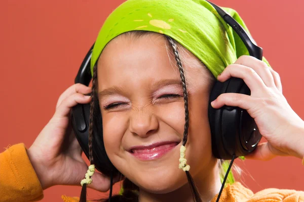 Child listening music in headphones — Stock Photo, Image