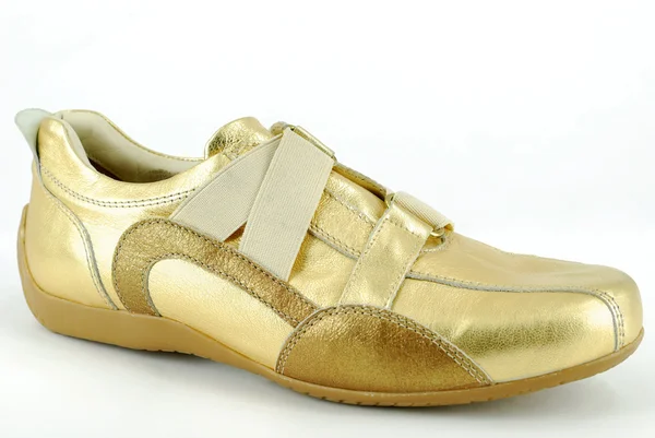 Žena zlaté tenisky boty — Stock fotografie