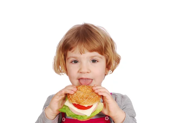 Liten flicka äter smörgås — Stockfoto