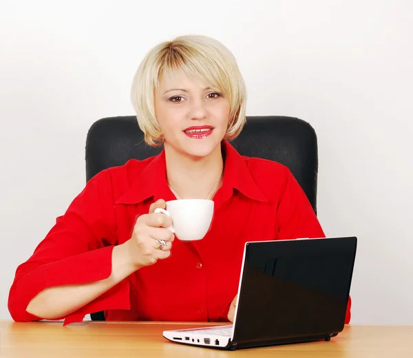 Business woman with coffee and laptop — Stock Photo, Image