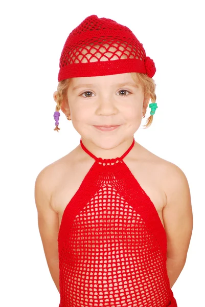 Klein meisje in de rode gebreide muts en jurk — Stockfoto
