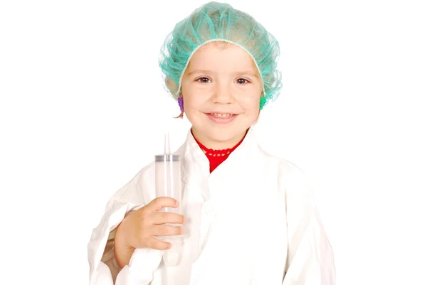Mała dziewczynka lekarz z duża strzykawka — Zdjęcie stockowe