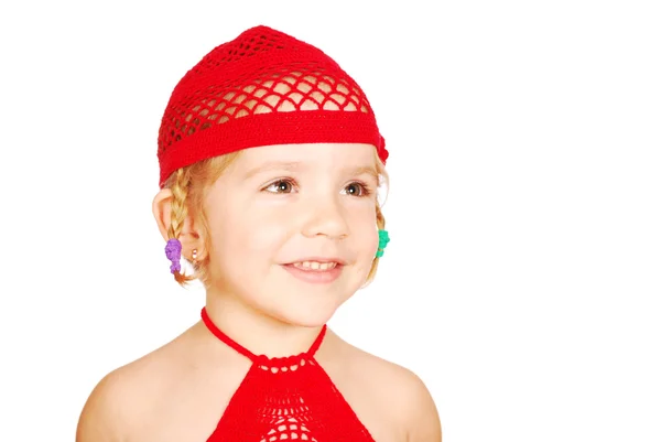 Liten flicka med röd Stickad mössa porträtt — Stockfoto