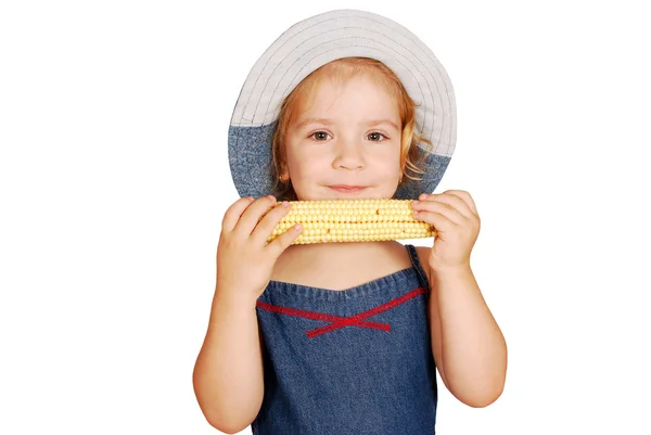 Lilla flickan äta majs — Stockfoto