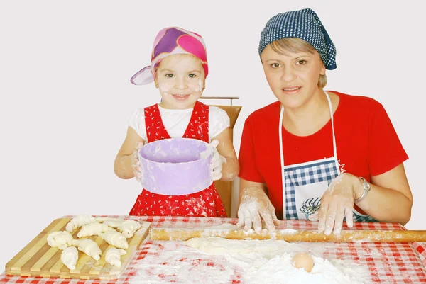 Mother and daughter make rolls — Stock Photo, Image