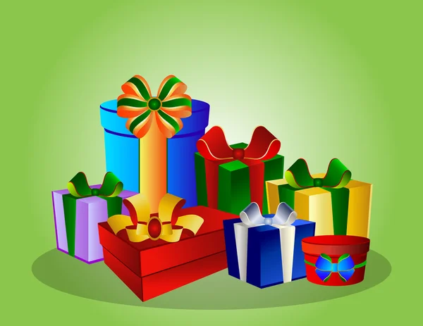 Kleurrijke geschenkdozen op groene achtergrond — Stockfoto