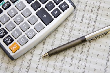 Balancing the Accounts. Calculator, pen clipart