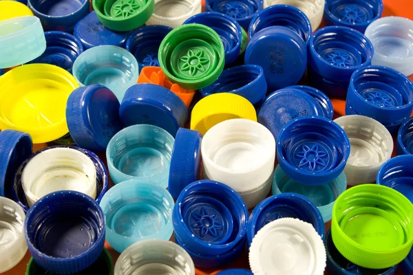 Műanyag kupakok háttér — Stock Fotó