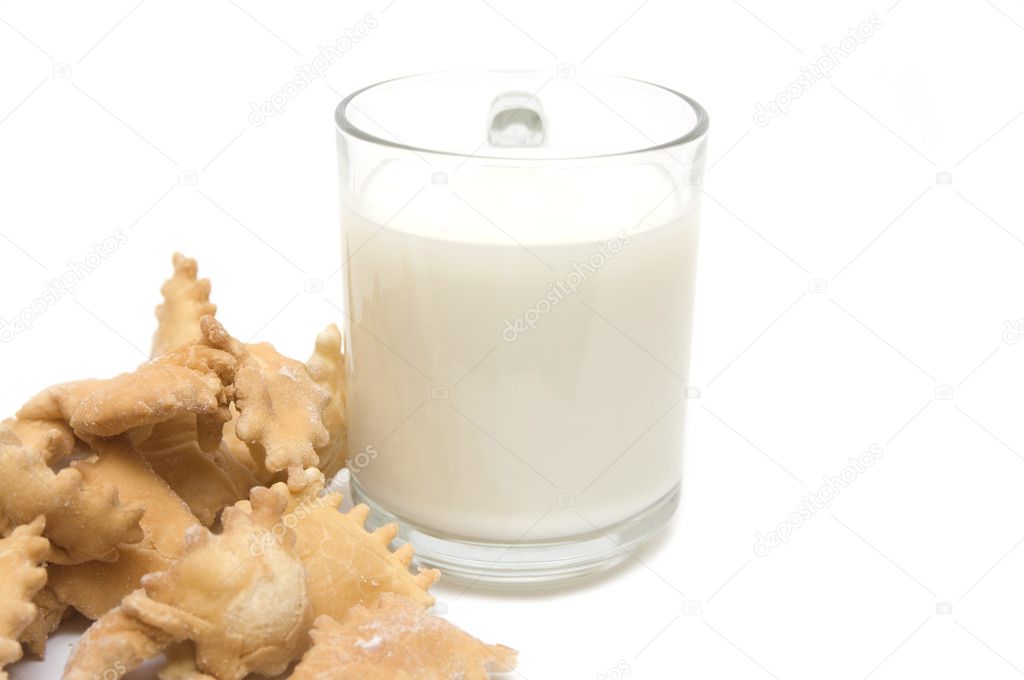 Cookies from wheat and a glass with milk