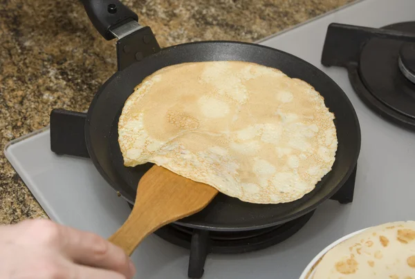 stock image Fried pancake on a frying-pan