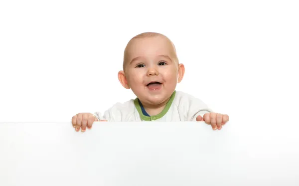Carino bambino ragazzo tenendo vuoto bianco bordo — Foto Stock