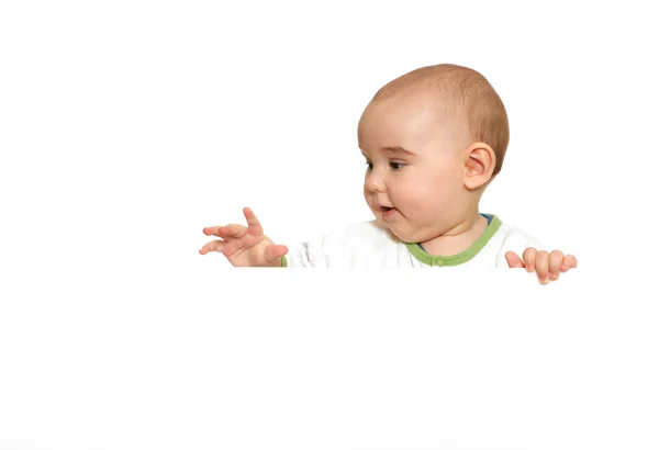 Schattige babyjongen bedrijf leeg leeg bord Stockfoto