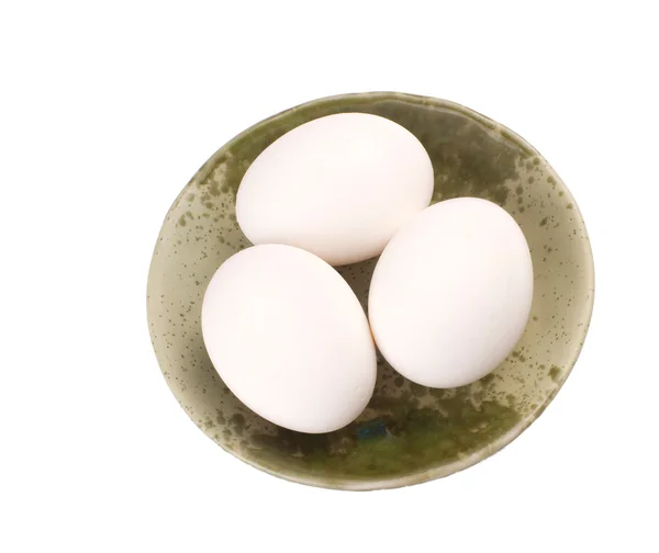 Tres huevos en un bol marrón — Foto de Stock