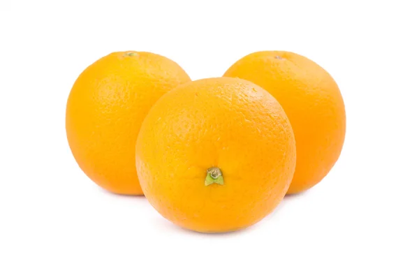Drie oranje vruchten ioslated — Stockfoto