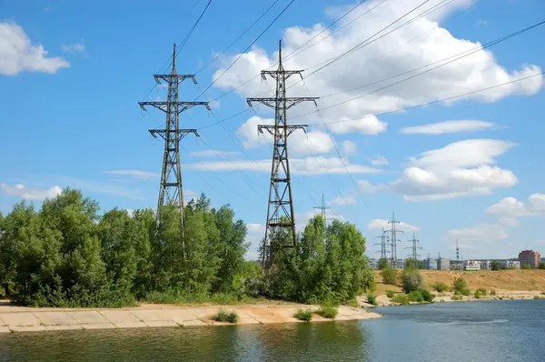 stock image Power plant with towers on river bank