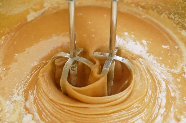 stock image Mixing a brown dough for a cake