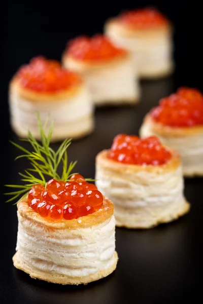 Stock image Tartlets with red caviar