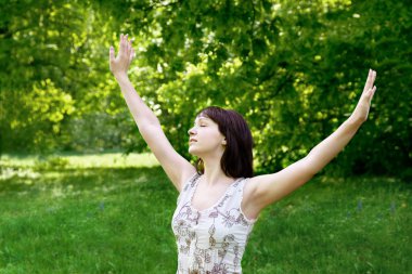 Young woman enjoying the fresh air clipart