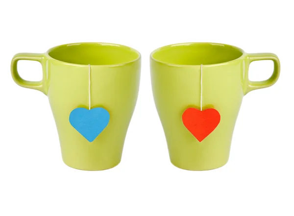 Tea bags with red and blue heart-shaped lables — Stock Photo, Image