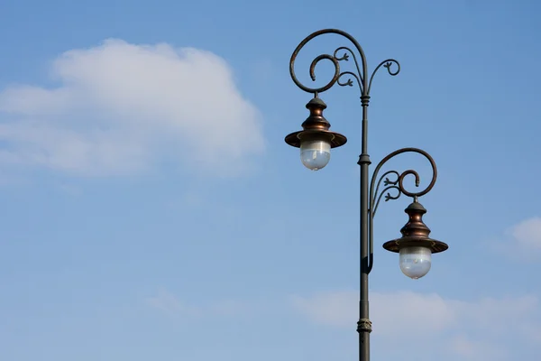Antique lamppost on blue sky — Stock Photo, Image