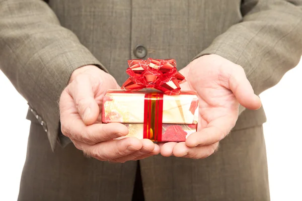Red gift in hands Stock Picture