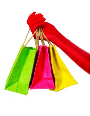 Hand with three shopping bags clipart