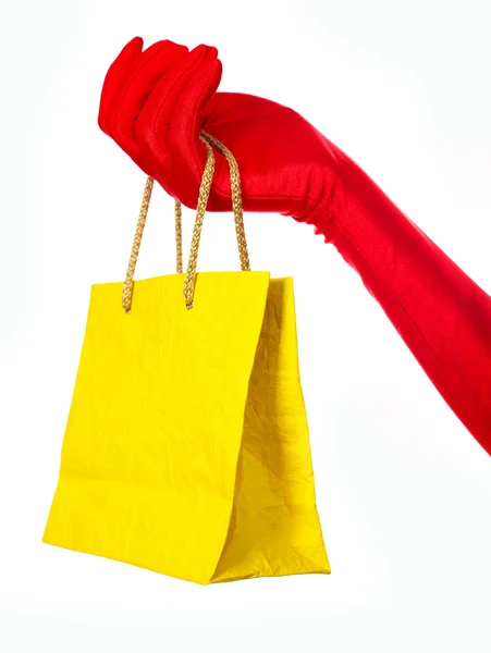 Mão com um saco de compras — Fotografia de Stock