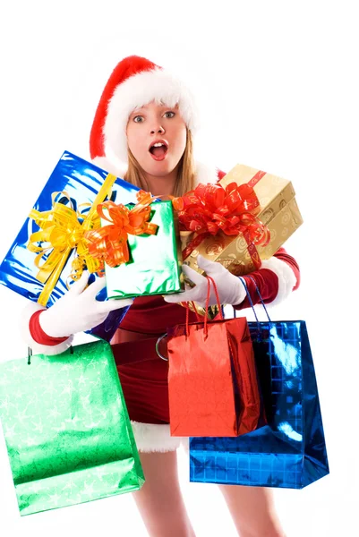 Mädchen als Weihnachtsmann verkleidet mit Geschenken — Stockfoto