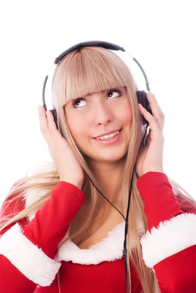 Meisje verkleed als santa luisteren naar de muziek — Stockfoto