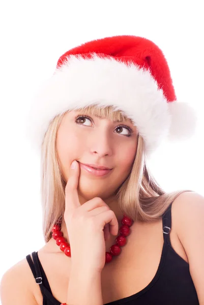 산타의 모자를 착용 하는 사려깊은 소녀 — 스톡 사진