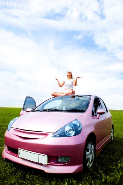 Girl on the car — Stock Photo, Image