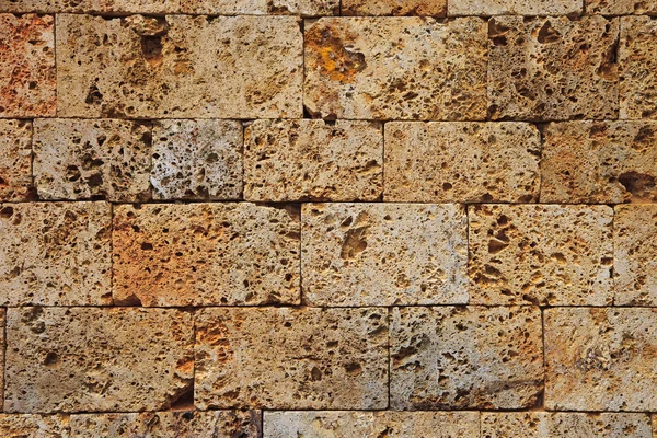 Стена из кирпича из песчаника — стоковое фото