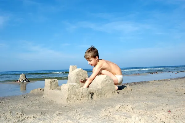 stock image Boy playing on the beach