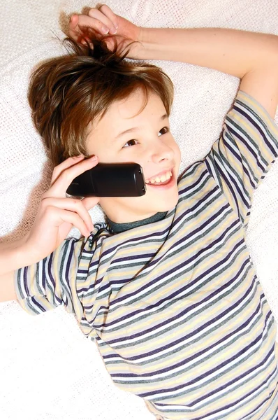 Teen boy talking on cell phone — Stock Photo, Image