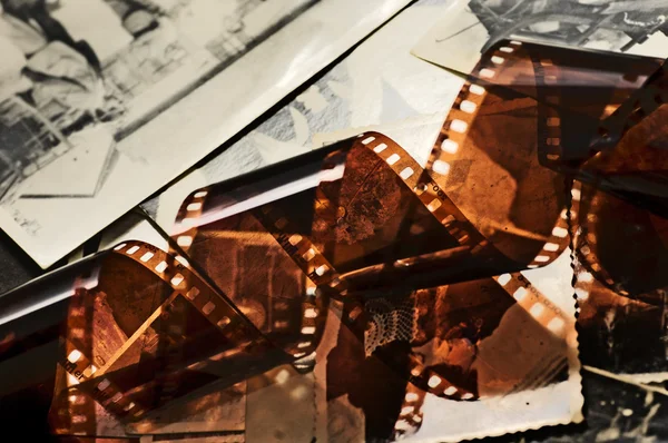 Old film strip and photos background — Stock Photo, Image