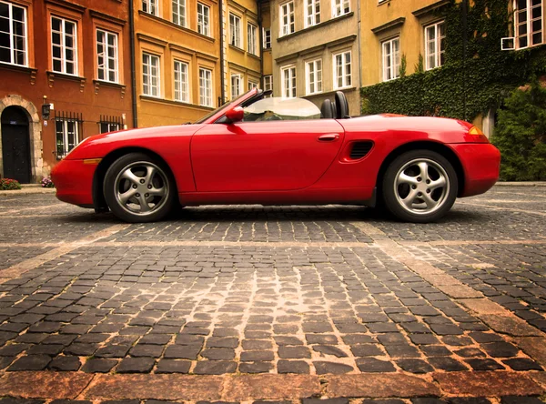 Sport car in the old town scenery — Stock Photo, Image