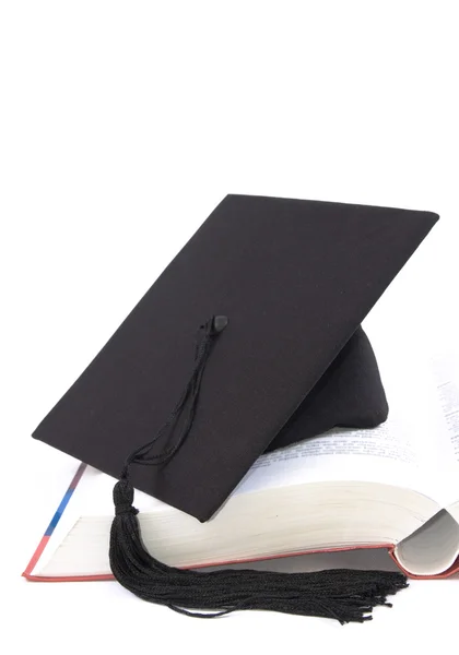 Egyetemista kalap és könyv — Stock Fotó