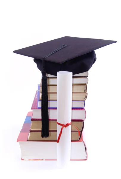 Book tower with student hat — Stock Photo, Image