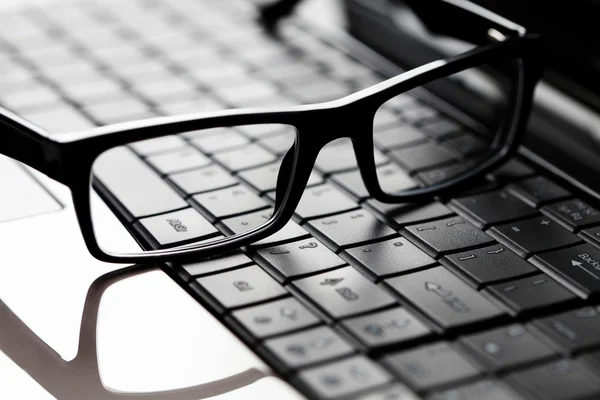 Stock image Glasses on laptop