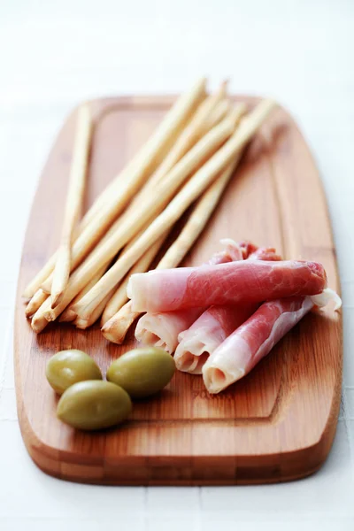 stock image Grissini with ham and olives