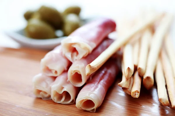 stock image Grissini with ham and olives