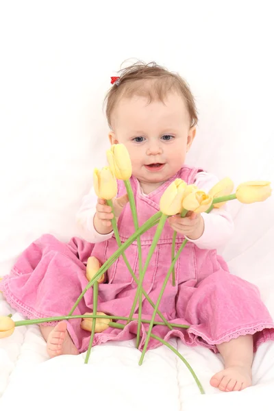 Baby girl with flowers — Stock Photo, Image
