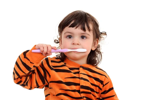 Дівчина і зубна щітка — стокове фото